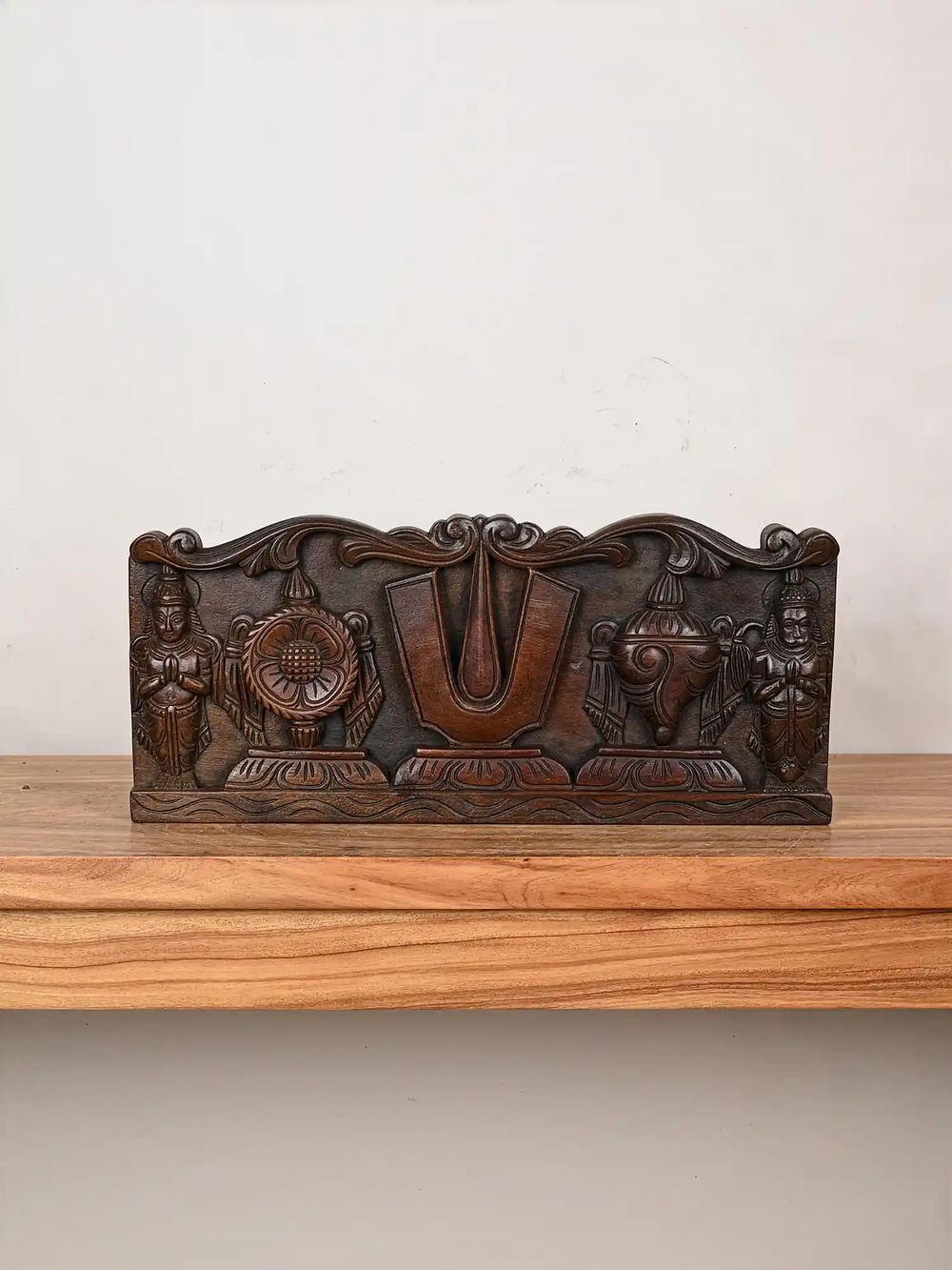Wooden wall panel of Vishnu's symbol