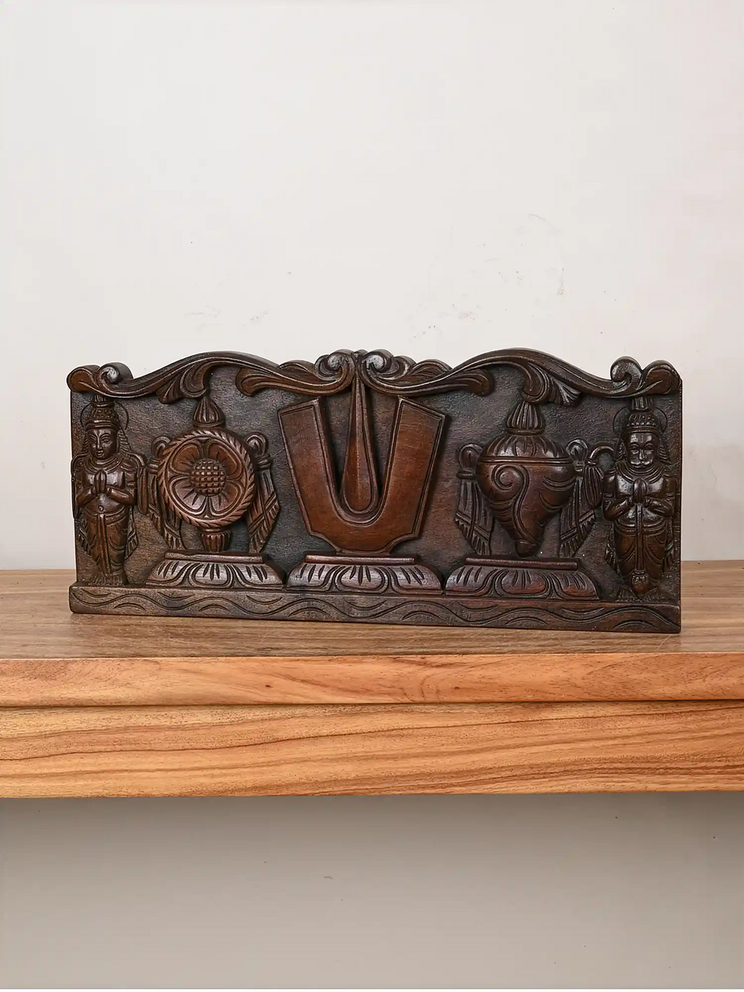 Wooden wall panel of Vishnu's symbol