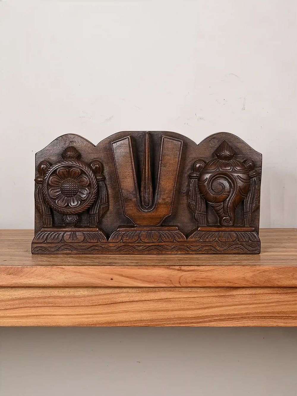 Wooden symbols of Vishnu wall panel