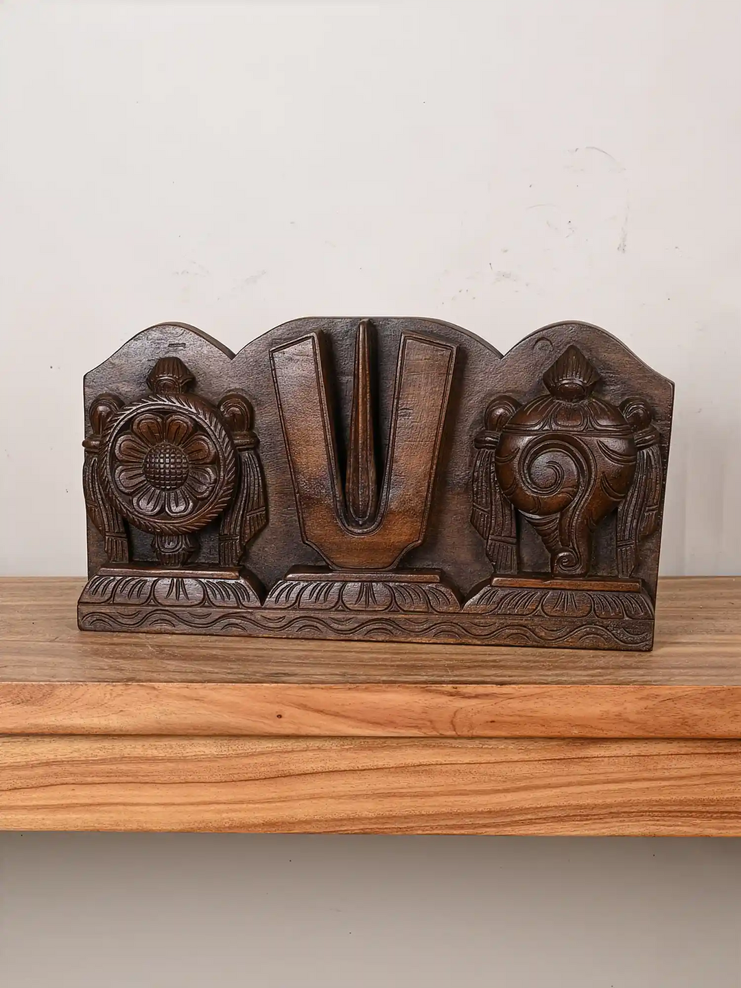 Wooden symbols of Vishnu wall panel