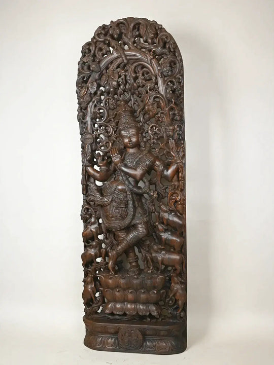 wooden krishna statue