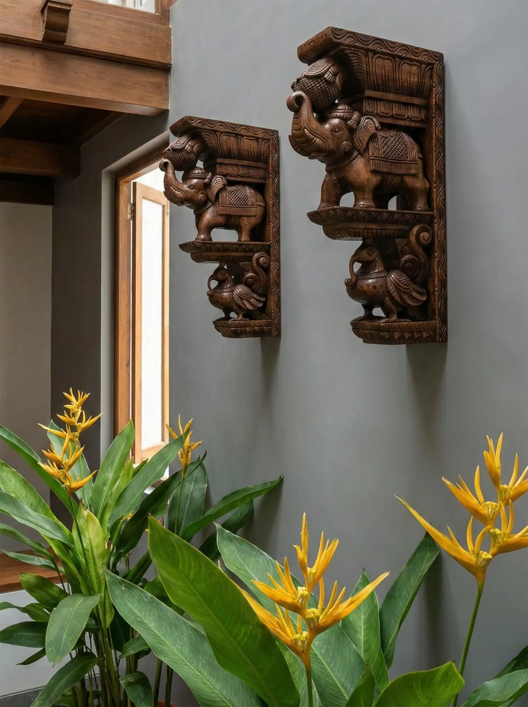 wooden brackets of elephant and hamsa