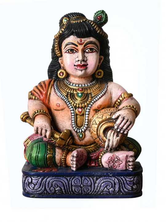 Handcrafted seated multi coloured Krishna wooden statue for home decor 

