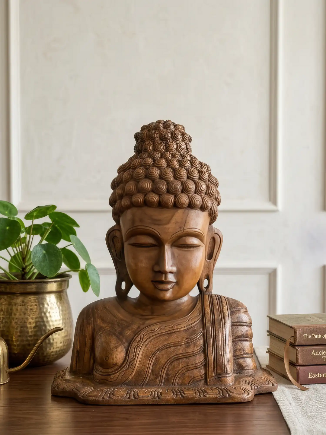 Wooden Buddha head sculpture for meditation and mindfulness spaces.