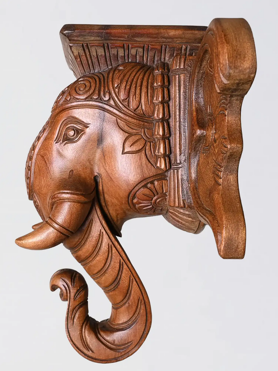 Handcrafted wooden elephant wall bracket with traditional temple carving