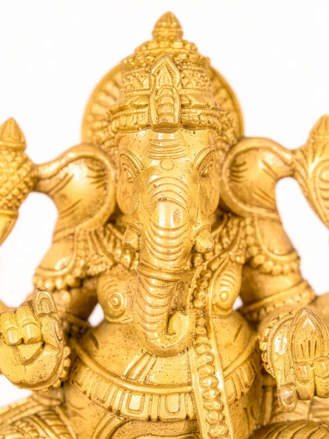 Handcrafted wooden Lord Ganesha idol with intricate South Indian carving