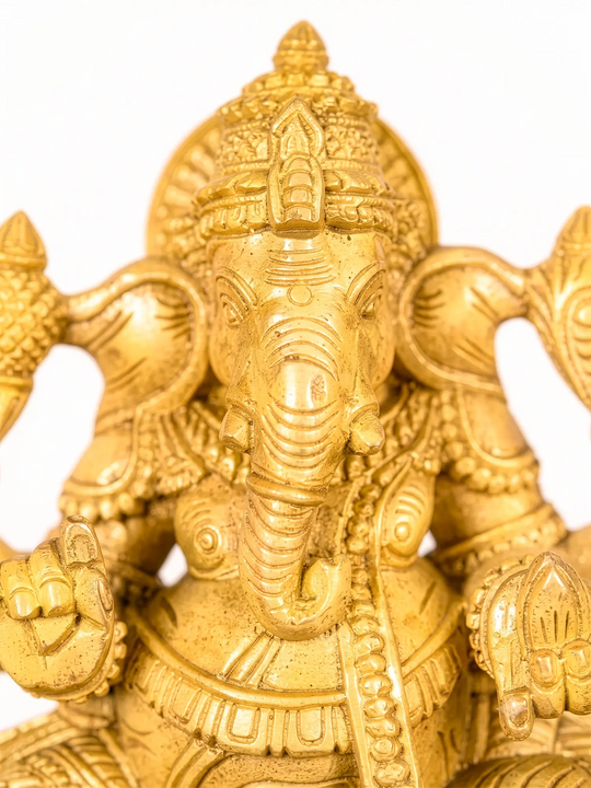 Handcrafted wooden Lord Ganesha idol with intricate South Indian carving