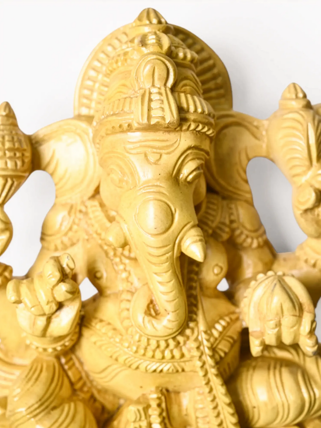 Wooden Ganesha statue for Vastu and positive energy.