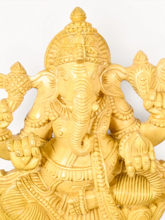 Elegant wooden Lord Ganesha sculpture symbolizing prosperity,
