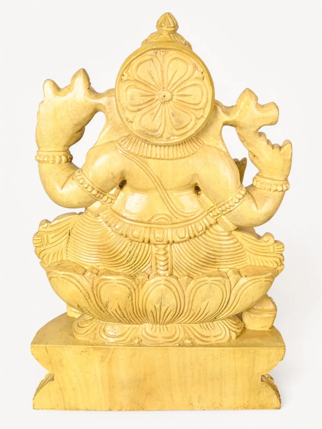 Classic wooden Ganesha murti created using traditional Indian wood carving techniques for luxury interiors.