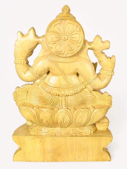 Classic wooden Ganesha murti created using traditional Indian wood carving techniques for luxury interiors.
