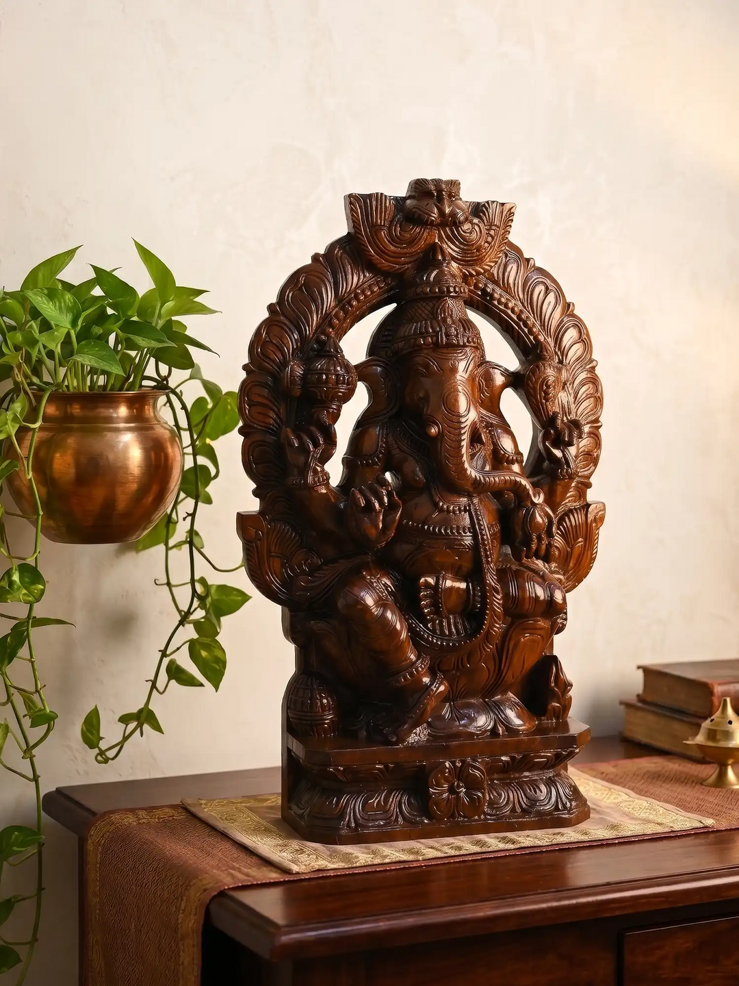 Handcrafted wooden Prabhavali Ganesha idol with intricate temple-style carvings