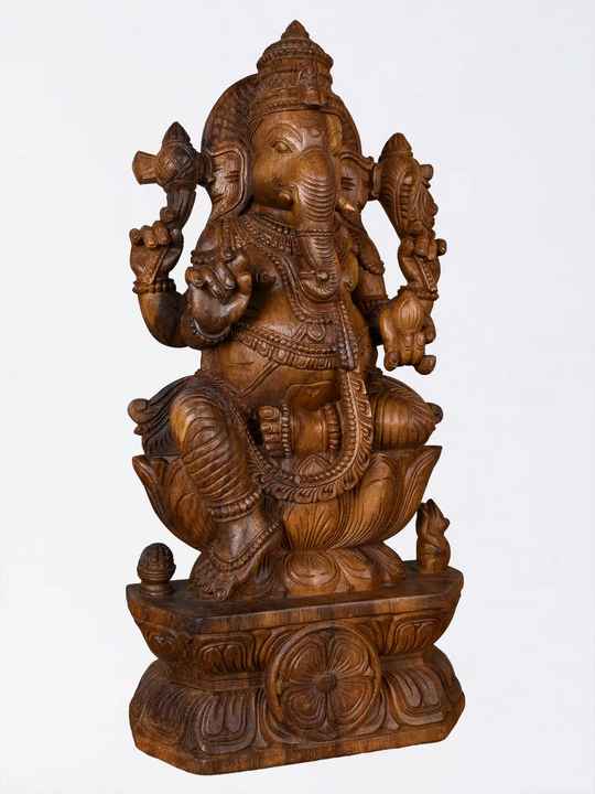 Carved wooden Ganesha statue for pooja room