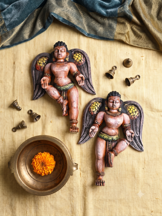 Hand carved angel wooden sculpture with intricate details
