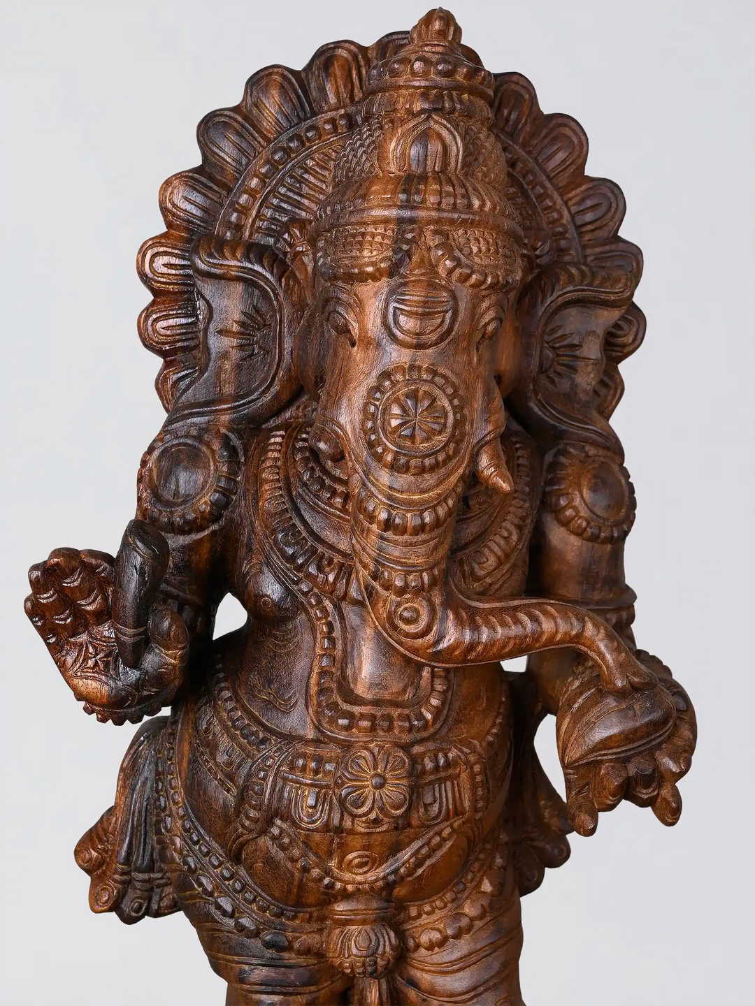 Handcrafted wooden Ganesh statue with carved pedestal