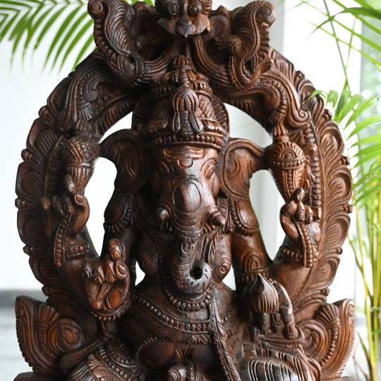 Traditional Hindu wooden Ganesh carving for home temple