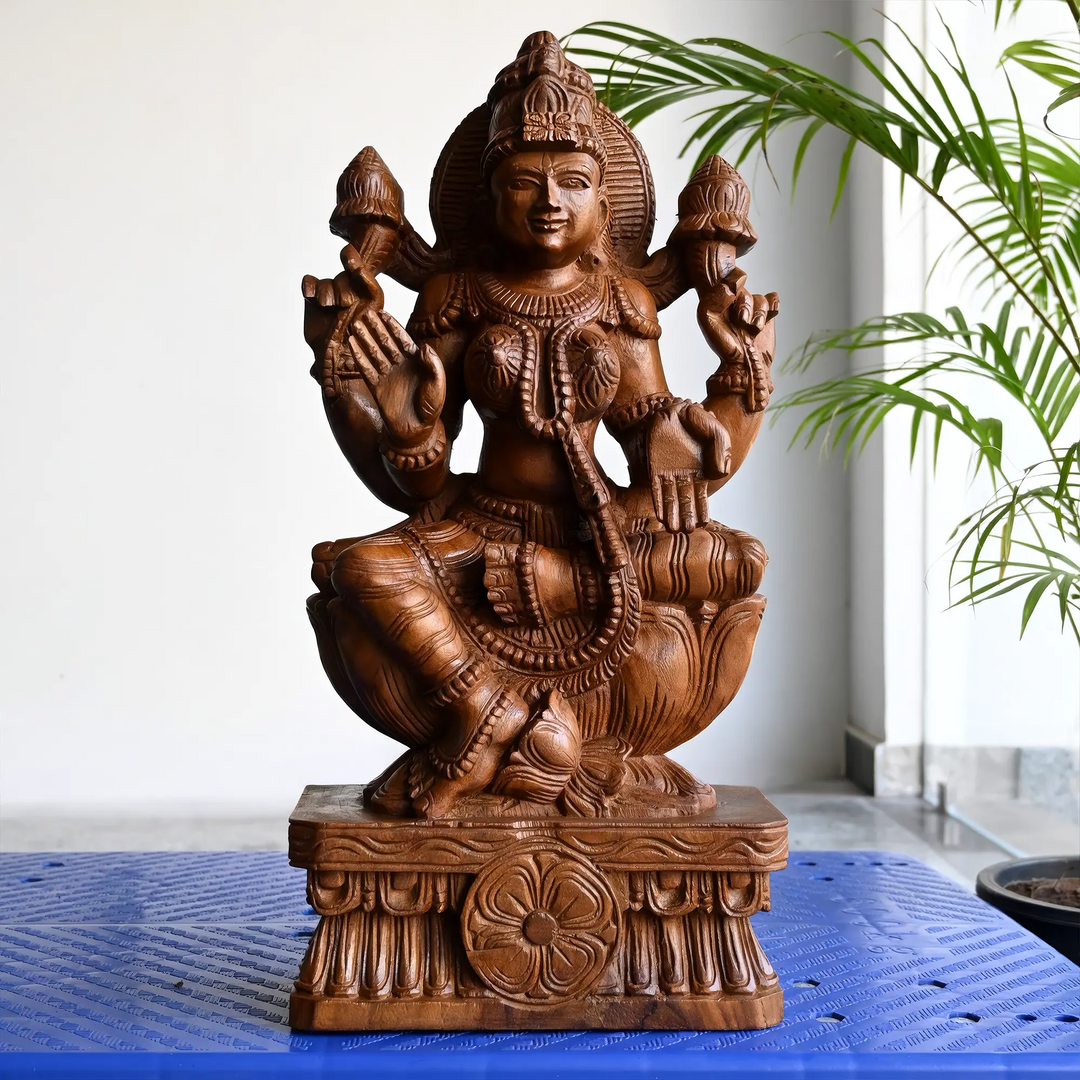 Artistic Lakshmi Amman silai showcasing traditional wood craftsmanship.