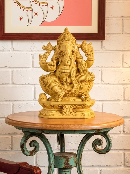 carved wooden Lord Ganesha statue seated on a lotus pedestal with intricate traditional Indian craftsmanship.