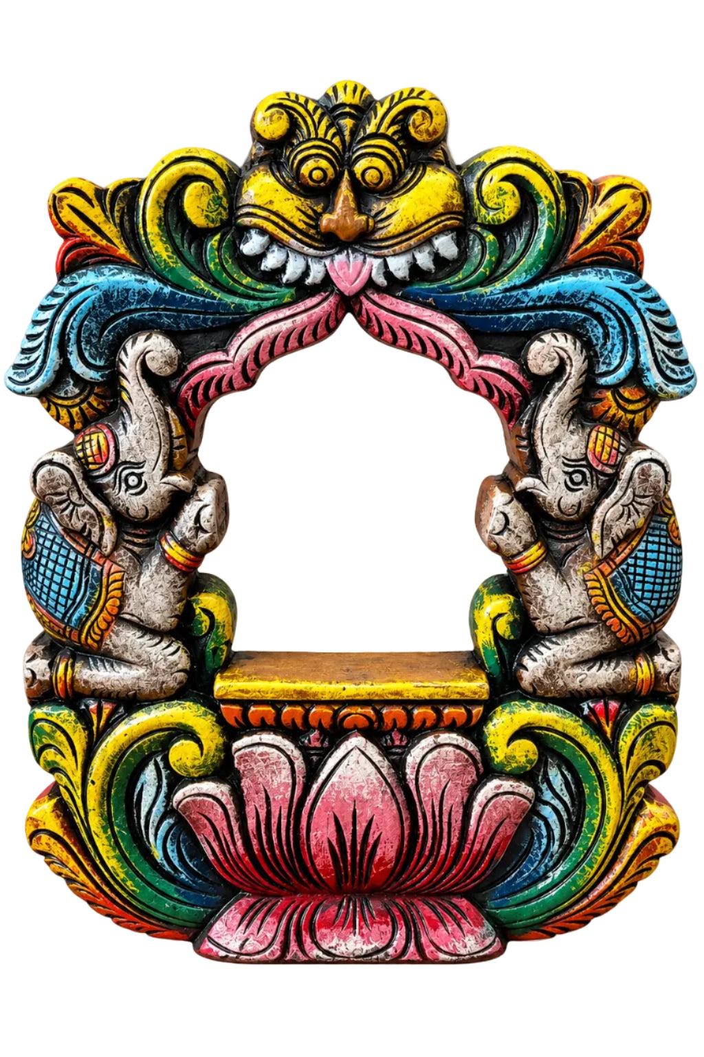 A hand-painted, multi-colored wooden decorative frame featuring elephant carvings, a lotus motif, and a central lion head, displayed on a wooden surface against a neutral draped fabric background.