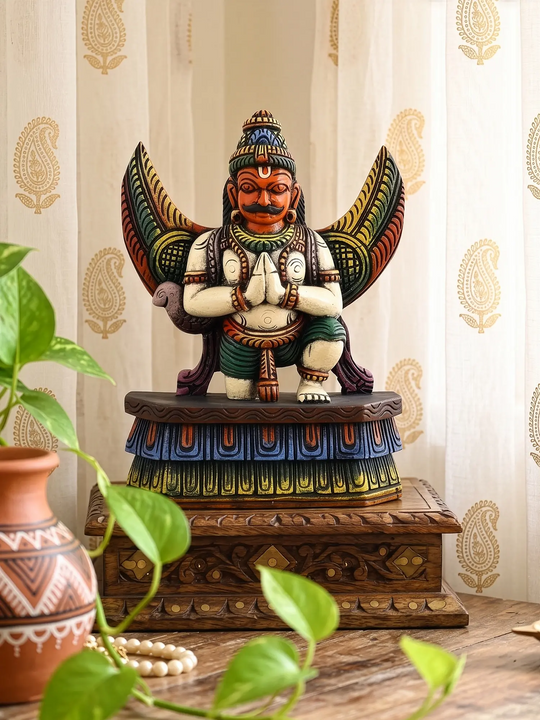 Multicolour handcrafted wooden Garuda statue for Hindu temple decor.