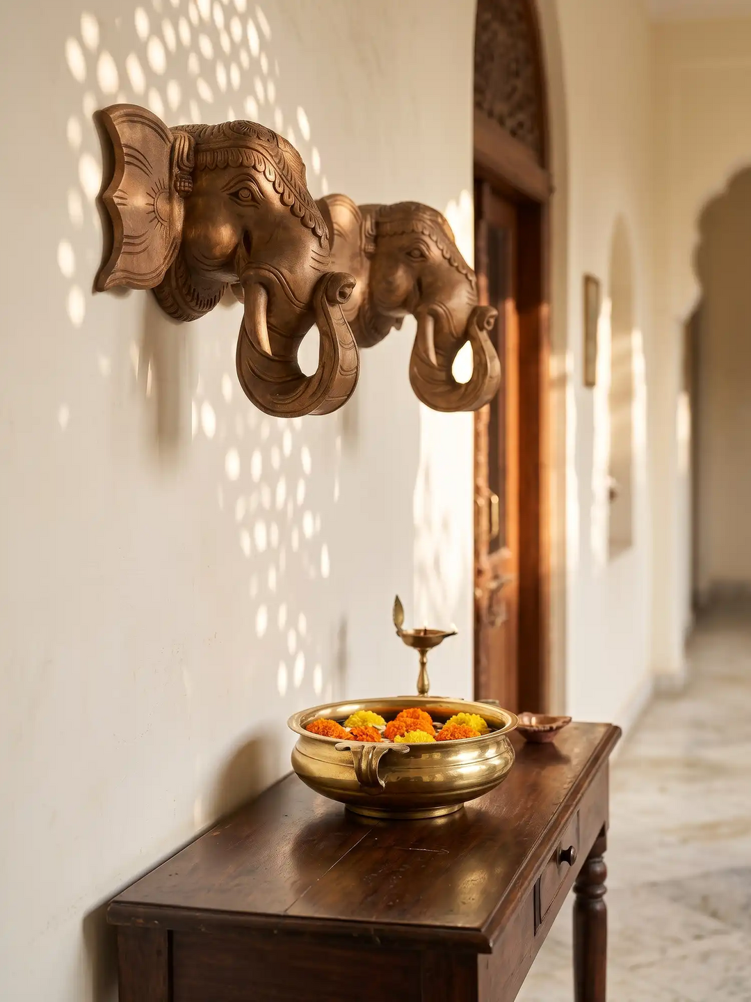 Carved wooden elephant wall bracket with Indian temple design