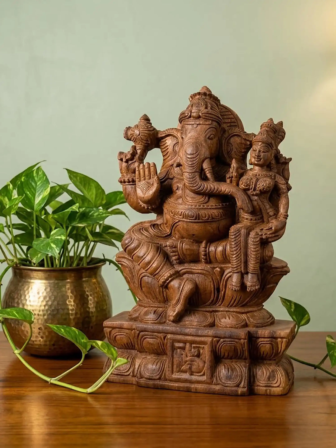 Vallabha Ganapati wood carving displayed as a sacred decorative idol