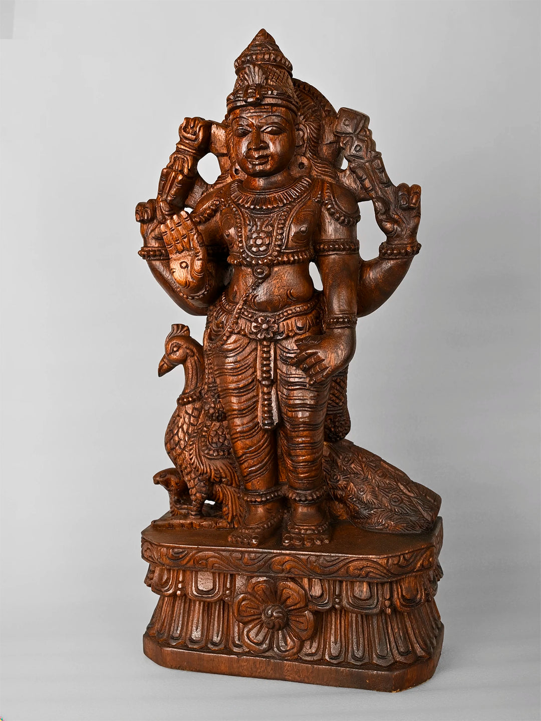 Traditional wooden Karthikeyan sculpture