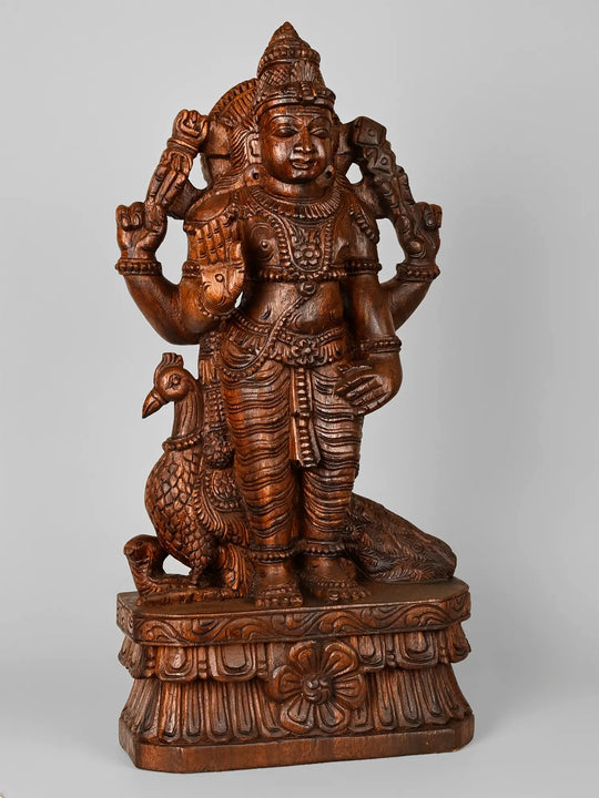 Traditional wooden Karthikeyan sculpture