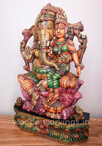Ganesha Seated on Dark Pink Lotus With His Consort Wooden Sculpture 35"