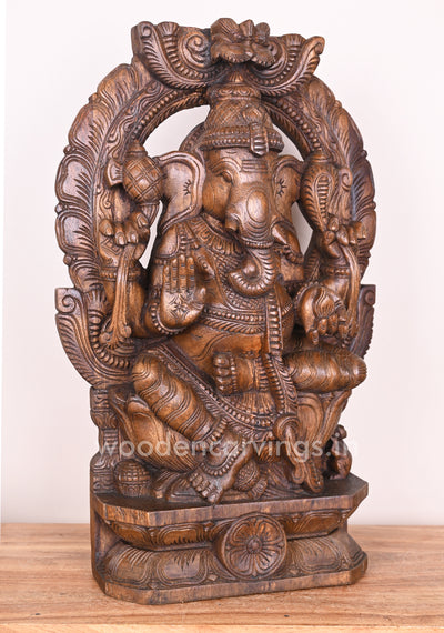 Arch Left Trunk Ganesha Blessing People in Mudra Abhaya on Lotus Wax Brown Wooden Sculpture 24"