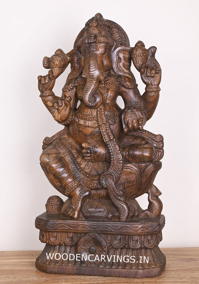 Shree Ganesha Seated on Lotus and Holding Sweet Prasad Mothak Wooden Wax Brown Handmade Sculpture 24"