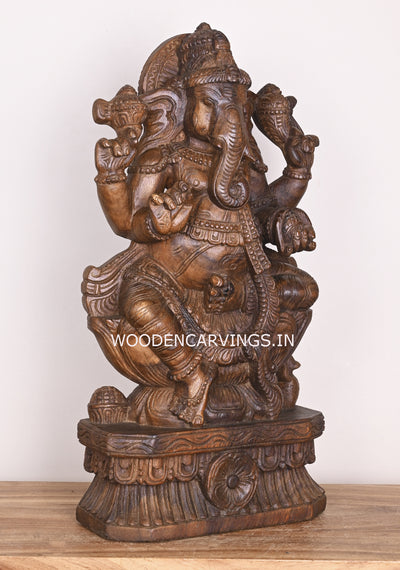 Shree Ganesha Seated on Lotus and Holding Sweet Prasad Mothak Wooden Wax Brown Handmade Sculpture 24"