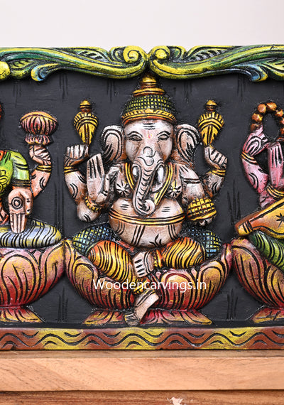Wooden Light Weight Easy Handled Lord Ganesh With Goddess Lakshmi and Saraswathi Horizontal Coloured Wall Panel 24"