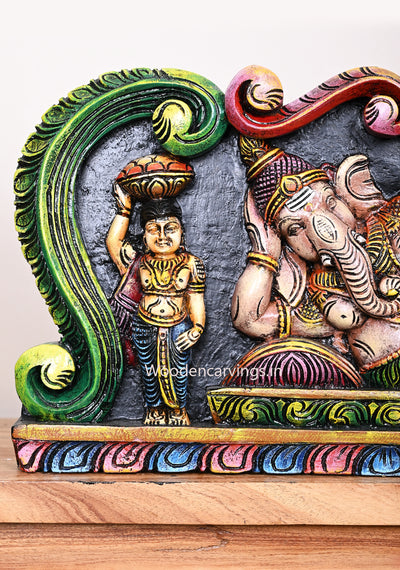 Reclining Realistic Look Lord Ganapathy With Sevagars Holding Jack Fruit Wooden Multicoloured Wall Panel 24"