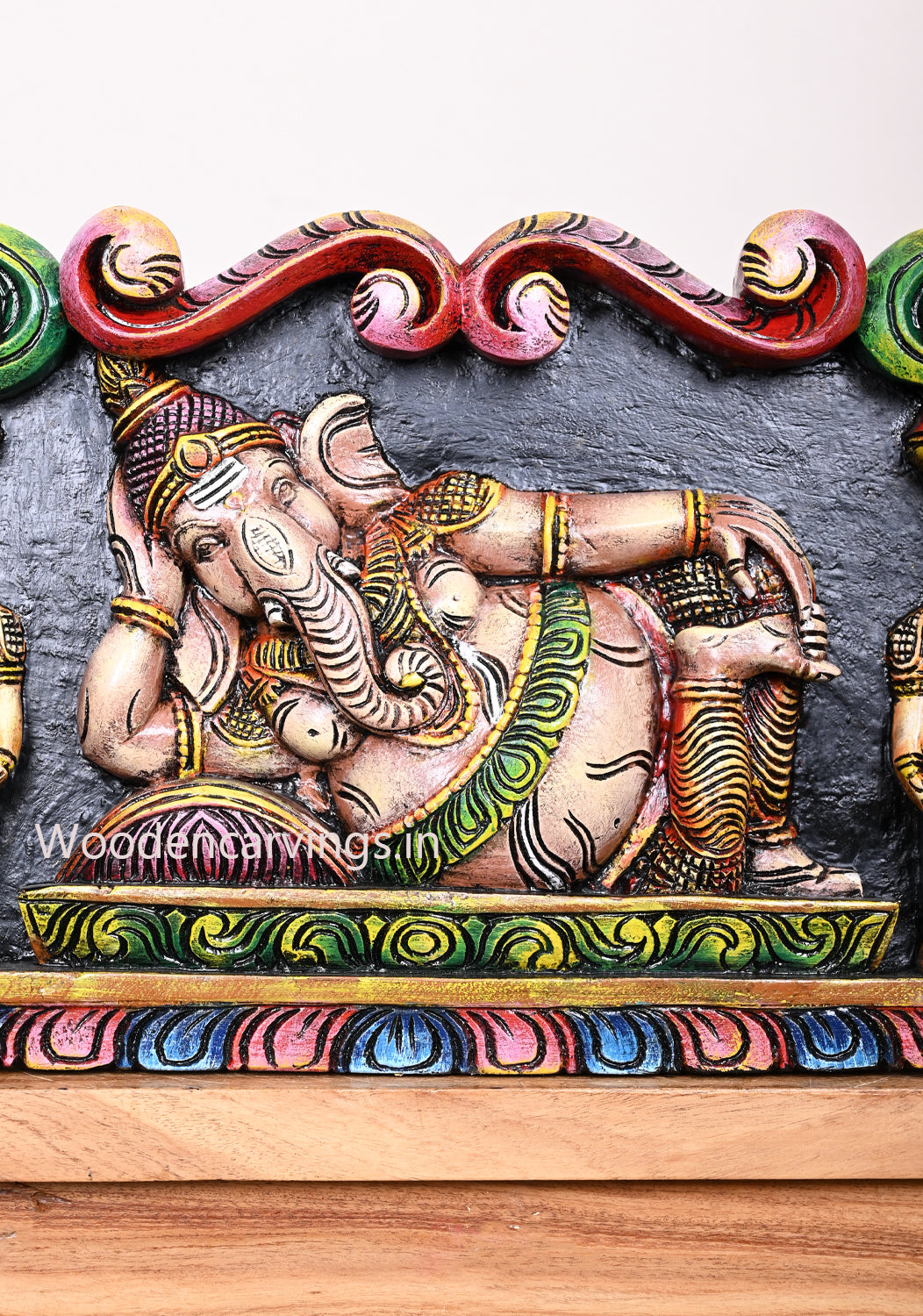 Reclining Realistic Look Lord Ganapathy With Sevagars Holding Jack Fruit Wooden Multicoloured Wall Panel 24"
