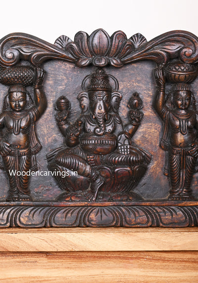 Gaja Ganesha With Goddess Lakshmi and Saraswathi Standing Hamsa Designed Horizontal Wax Brown Wall Panel 44.5"