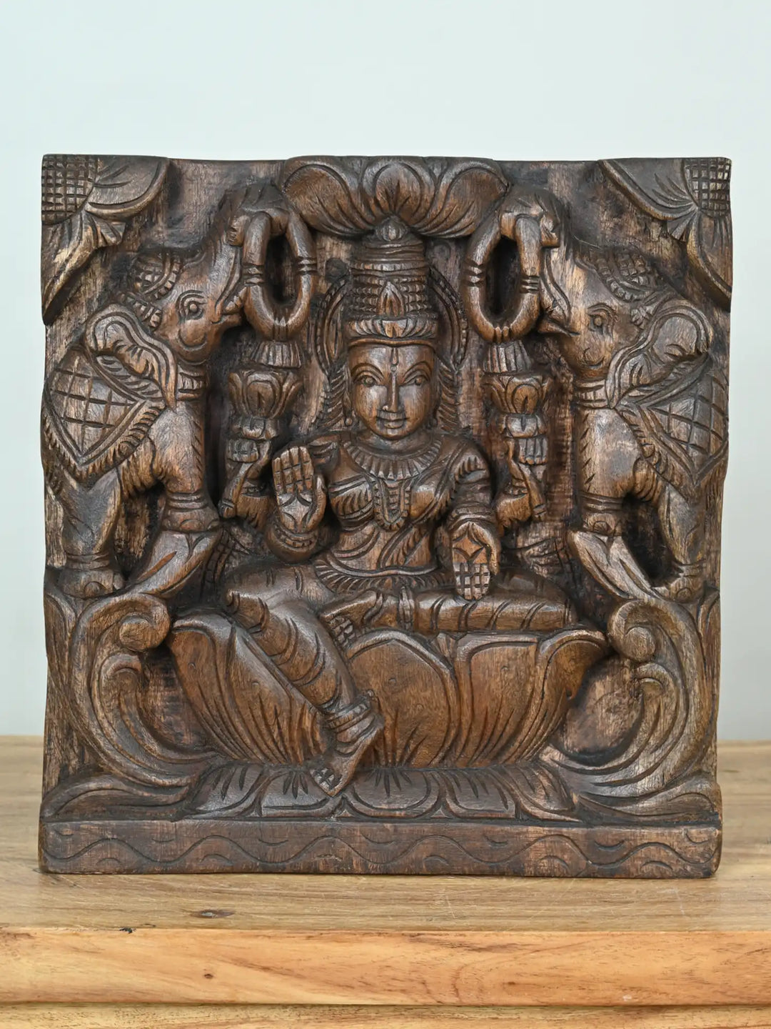 wooden lakshmi devi with elephants