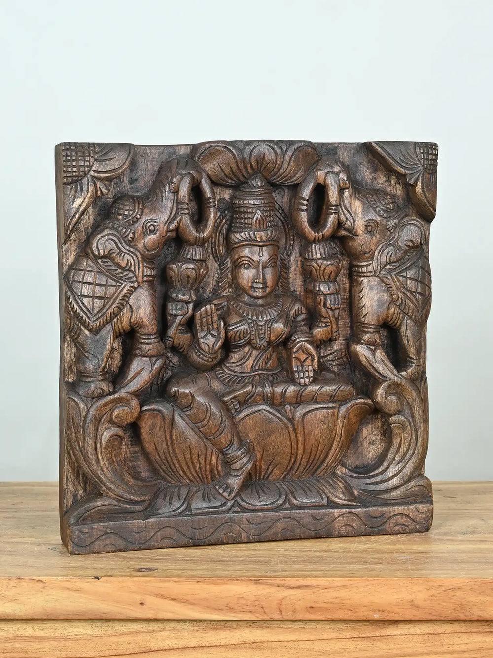 wooden lakshmi devi with elephants