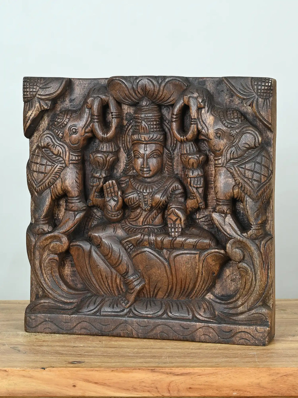 wooden lakshmi devi with elephants