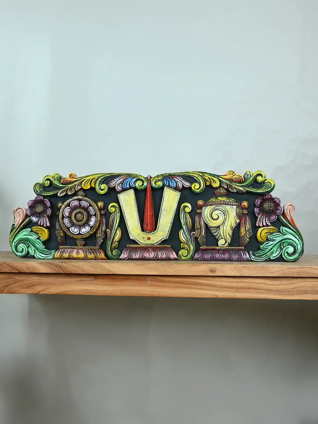 Carved wooden panel Vishnu's Shangu Chakra Namam