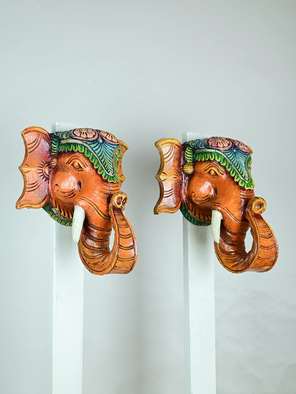 Paired wooden elephant face mask