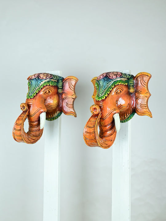 Paired wooden elephant face mask