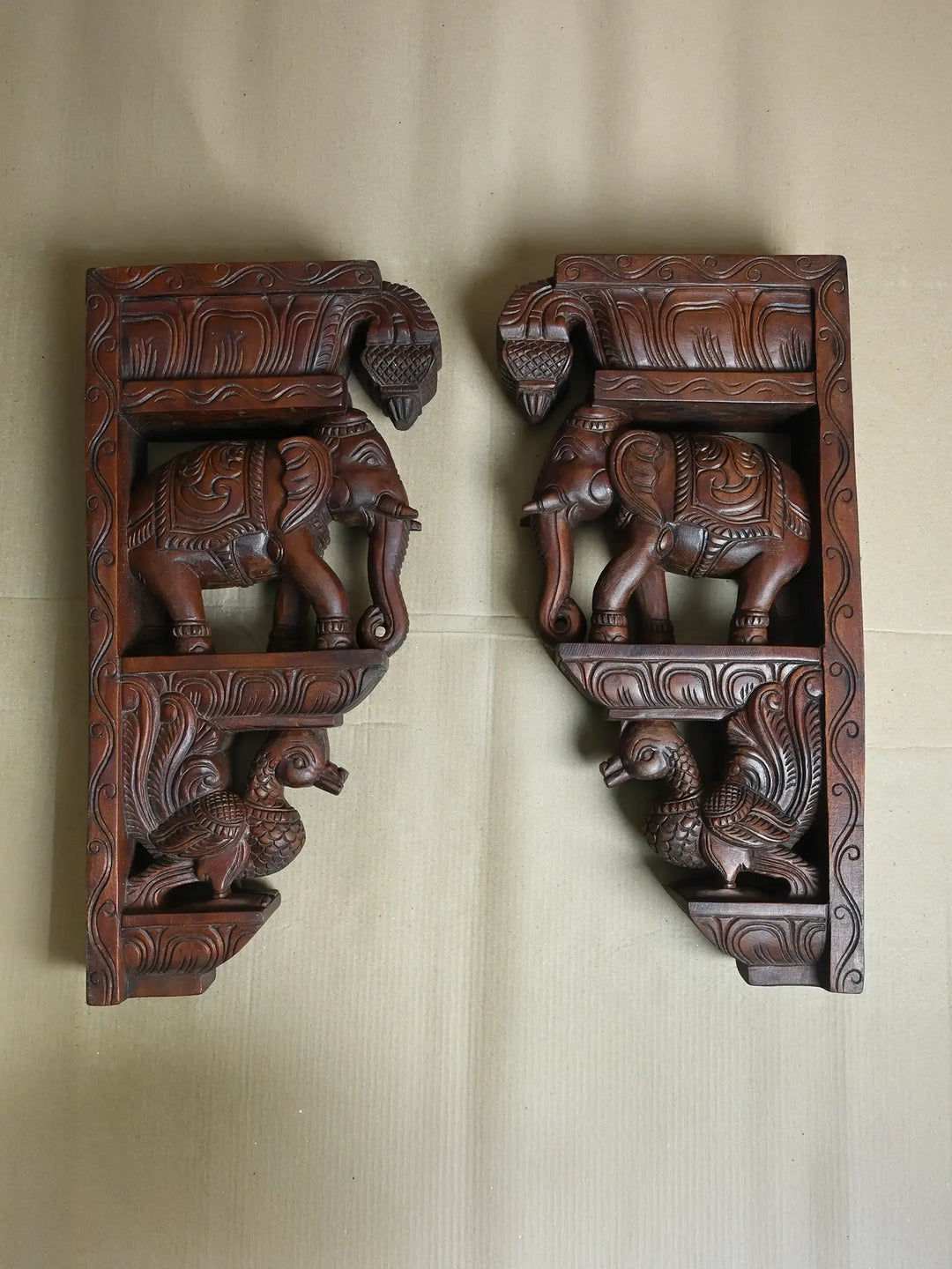 wooden elephant and hamsa brackets