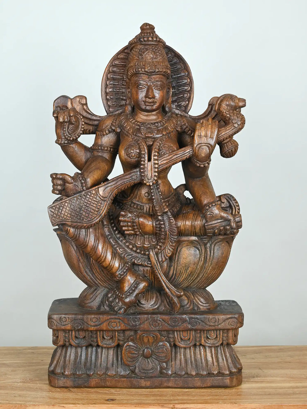 Saraswati Wooden Idol Sitting in Lotus