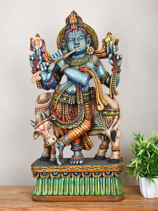 Wooden Krishna with cow statue