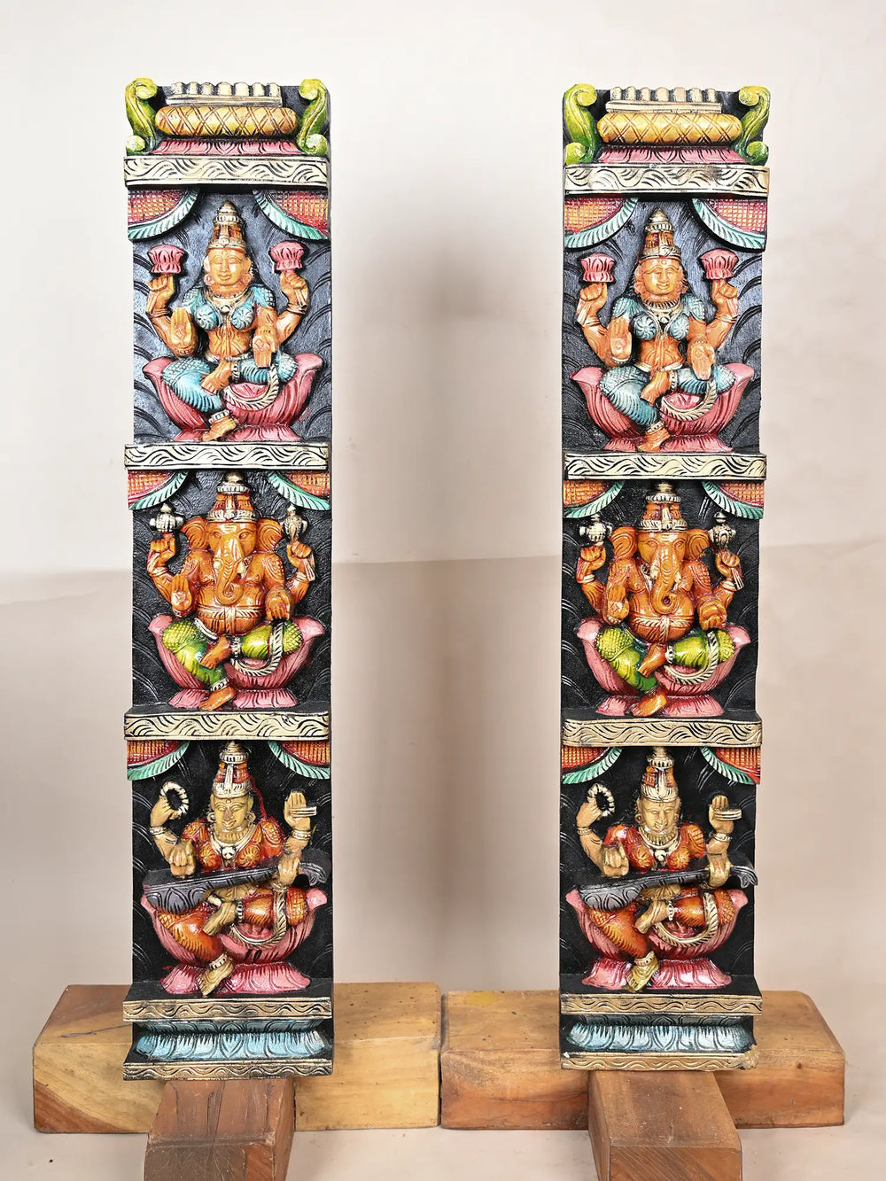 Wooden panel of Ganesh, Lakshmi, and Saraswathi 