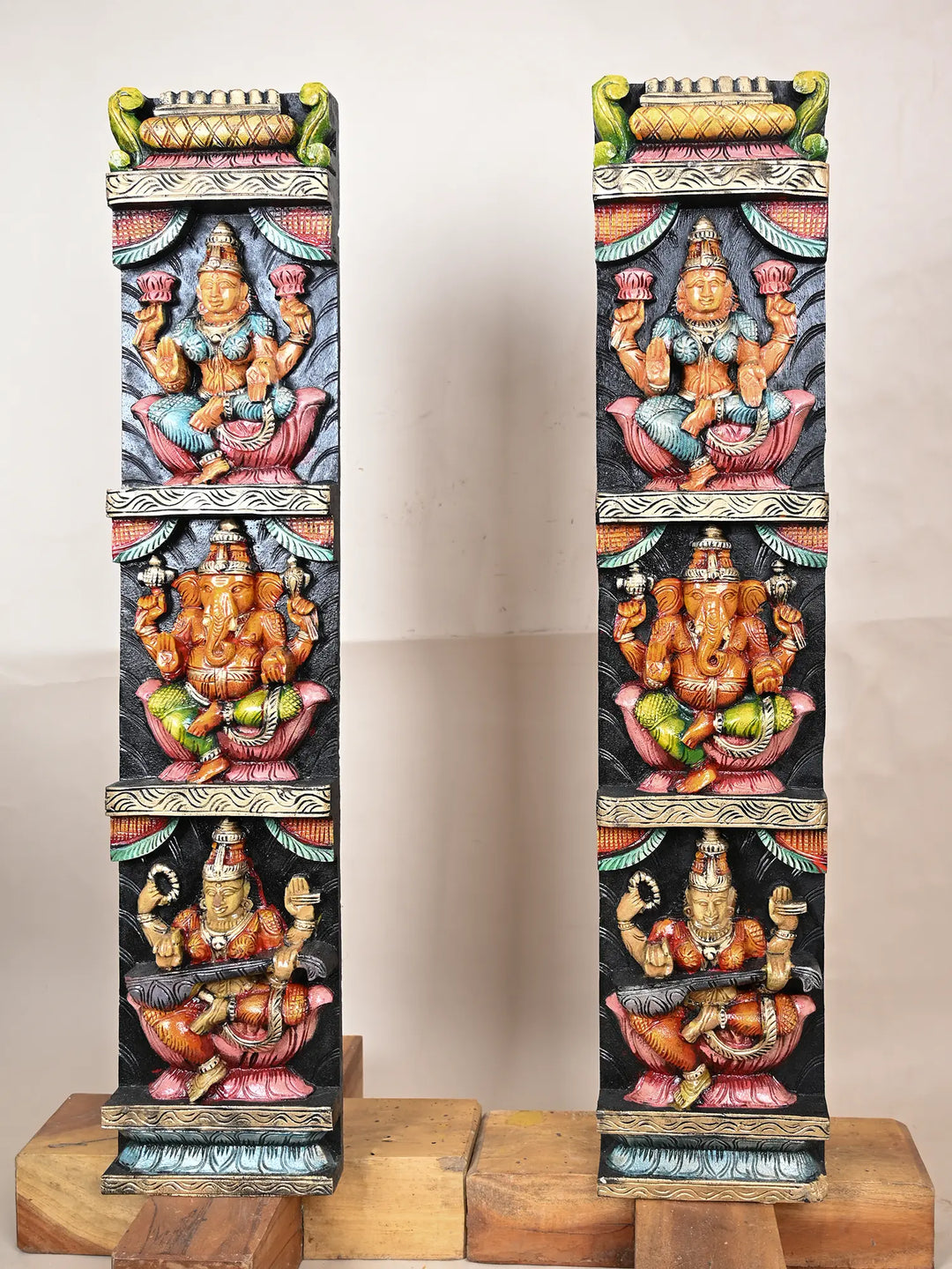 Wooden panel of Ganesh, Lakshmi, and Saraswathi 