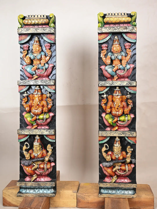 Wooden panel of Ganesh, Lakshmi, and Saraswathi 