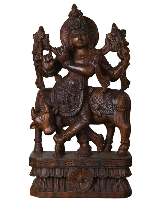 wooden krishna statue