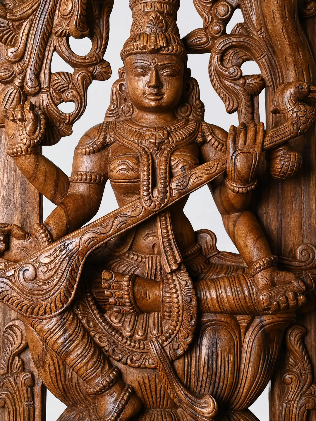 wood carving decor Saraswathi detailing, intricate handmade wood carved statue craftsmanship
